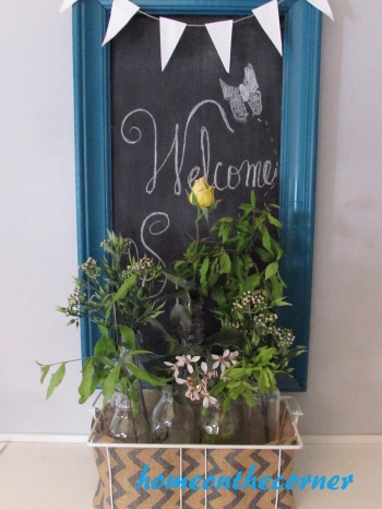 dining room refresh welcome flowers in bottles