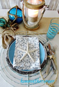 tablescapes 2017 nautical starfish, candle lantern, glass floats