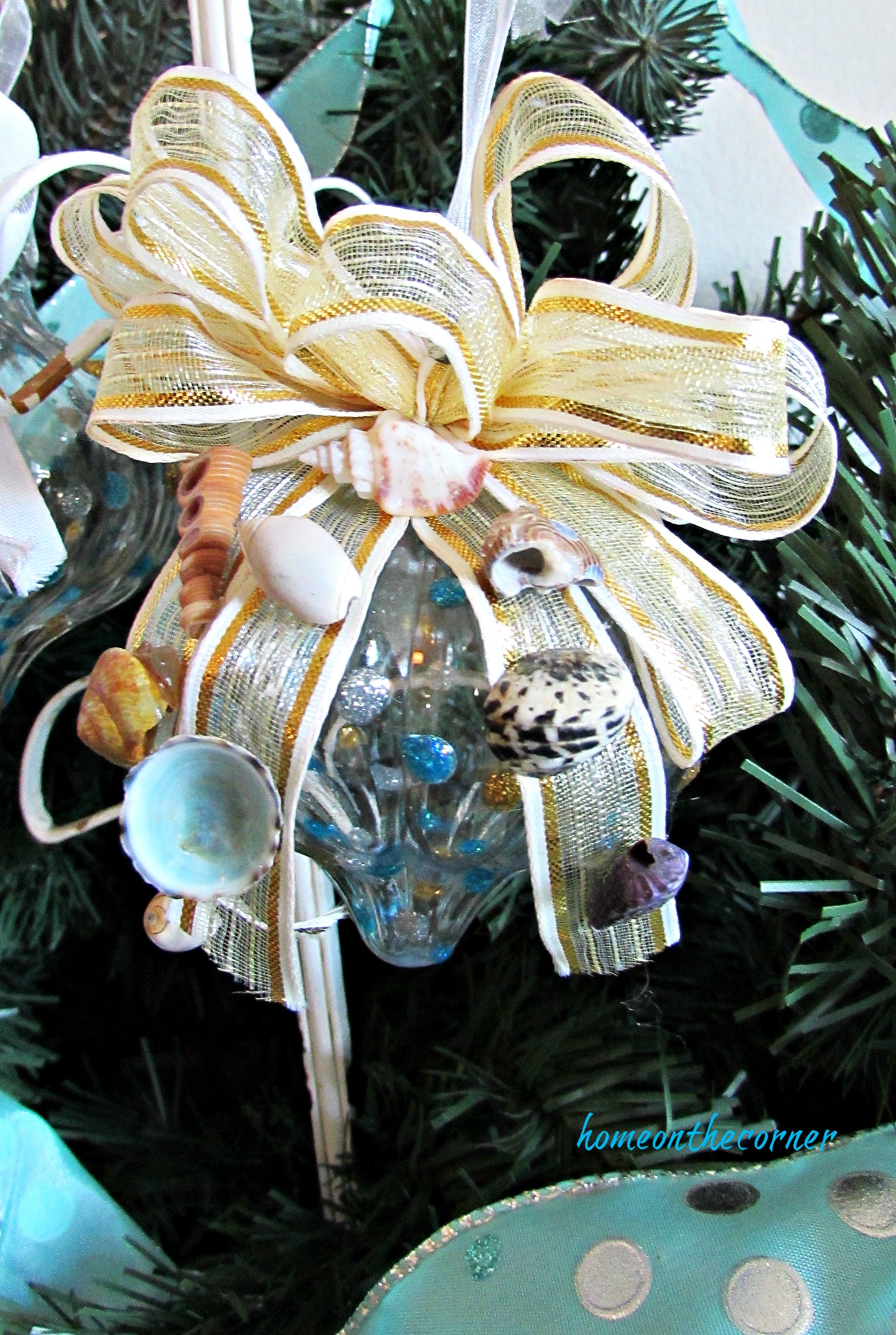 turquoise ornament gold bow and seashells